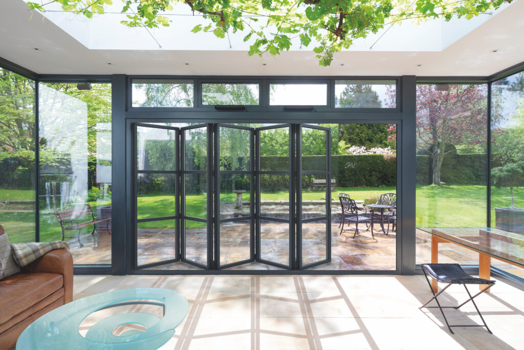 partially open bifold doors to explain bifolding or sliding doors concept